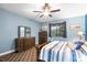 Bedroom featuring a comfortable bed, stylish furnishings, and lots of natural light at 8807 Tatara St, Orlando, FL 32836
