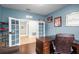 Spacious home office with wood floors and a large desk at 8807 Tatara St, Orlando, FL 32836