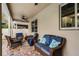 Inviting outdoor patio with comfortable seating, ceiling fan, and brick pavers, perfect for relaxation and entertaining at 8807 Tatara St, Orlando, FL 32836