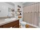 This bathroom showcases wood-look flooring and matching vanity at 10 Pine Course Pass, Ocala, FL 34472