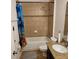 Bathroom with a shower over tub with tiled walls, a black vanity with granite countertop, and tile flooring at 1107 Galway Blvd, Apopka, FL 32703