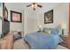 Cozy bedroom with ceiling fan, closet, and contemporary decor at 11278 Papyrus Ln, Orlando, FL 32821