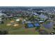 Panoramic aerial view showcasing the community's sports facilities, pool, and surrounding landscape at 12100 Calaboose Ct, Orlando, FL 32828