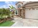 Inviting front entrance with brick accents, manicured landscaping, and a well-maintained walkway leading to the front door at 12100 Calaboose Ct, Orlando, FL 32828