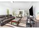 Bright and airy living room featuring a comfortable seating area and an open layout, perfect for modern living at 12100 Calaboose Ct, Orlando, FL 32828