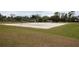 Outdoor volleyball court with fine sand provides a fun recreational amenity within the community at 12100 Calaboose Ct, Orlando, FL 32828