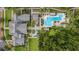 Aerial view showcases pool, greenery, walkways, and building roof, offering great community features at 1211 Stonecutter Dr # 304, Celebration, FL 34747