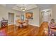 Inviting dining area featuring hardwood floors, a modern chandelier, and a view of the kitchen at 1211 Stonecutter Dr # 304, Celebration, FL 34747