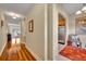 Arched doorway leading into the kitchen, with hardwood floors, and neutral walls at 1211 Stonecutter Dr # 304, Celebration, FL 34747