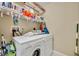 Functional laundry area with a washer, dryer, and shelving for organization and storage at 1211 Stonecutter Dr # 304, Celebration, FL 34747