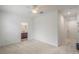 Spacious bedroom with light carpet and a view to a bathroom at 1230 Mercedes Pl, Orlando, FL 32804