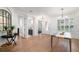 Bright dining room featuring wood floors, large windows, modern chandelier, and neutral decor at 1230 Mercedes Pl, Orlando, FL 32804