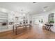 Open dining room showcasing a custom built-in bookcase and seamless flow to living spaces at 1230 Mercedes Pl, Orlando, FL 32804