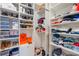 Organized walk-in closet with shelving and storage for shoes, clothes, and accessories at 1230 Mercedes Pl, Orlando, FL 32804