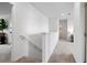 Upstairs hallway featuring carpet, white walls and trim, and entry to various rooms at 1239 Big Bass Dr, Ormond Beach, FL 32174