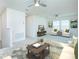 Living room featuring a neutral color palette, lots of natural light, and ceiling fans at 14250 Lanikai Beach Dr, Orlando, FL 32827