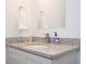 Close-up of bathroom featuring granite countertop, white vanity, and modern faucet at 14742 Sw 43Rd Terrace Rd, Ocala, FL 34473