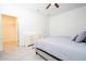 Bedroom featuring a walk in closet, neutral color scheme, a ceiling fan, and tile flooring at 14742 Sw 43Rd Terrace Rd, Ocala, FL 34473