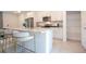 Kitchen island featuring seating and granite countertops at 14742 Sw 43Rd Terrace Rd, Ocala, FL 34473