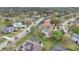 Aerial view of neighborhood with manicured lawns, mature trees, and a variety of home styles at 1601 Billingshurst Ct, Orlando, FL 32825