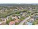 An aerial view of a well-planned community featuring mature trees, lawns, and landscaping at 1601 Billingshurst Ct, Orlando, FL 32825