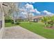 Spacious backyard featuring green grass and landscaping at 1601 Billingshurst Ct, Orlando, FL 32825