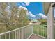 View of the backyard with green grass and a balcony at 1601 Billingshurst Ct, Orlando, FL 32825