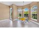 Bright breakfast nook featuring tile floors, arched windows, and cozy seating at 1601 Billingshurst Ct, Orlando, FL 32825