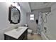 Bathroom featuring new sink vanity, updated fixtures, white tub and shower, and tile flooring, creating a clean and modern look at 1750 E Welch Rd, Apopka, FL 32712