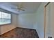 Cozy bedroom featuring neutral carpet, a ceiling fan, and a window for natural light at 1750 E Welch Rd, Apopka, FL 32712