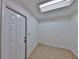 Unfurnished space with tile floors, a bright overhead light, and white painted walls at 1750 E Welch Rd, Apopka, FL 32712