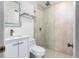 Bathroom featuring an enclosed shower with modern fixtures, a sink with vanity, and neutral-colored tiles at 1913 Woodcrest Dr # B, Winter Park, FL 32792