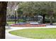 Scenic park fountain featuring a statue in a brick surround with lush landscaping at 1913 Woodcrest Dr # B, Winter Park, FL 32792