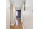 Hallway with wood flooring leading to a bedroom at 1913 Woodcrest Dr # B, Winter Park, FL 32792