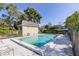 Outdoor pool with a clean, rectangular design surrounded by chairs and a small pool house at 1913 Woodcrest Dr # B, Winter Park, FL 32792