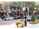 Beautiful streetscape featuring a black clock, retail shops, awnings, and parked cars along the street at 1913 Woodcrest Dr # B, Winter Park, FL 32792