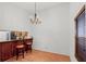 Dining area featuring a bar counter with chandelier lighting at 2106 Northlake Dr # 2106, Sanford, FL 32773