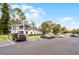 Condominium exterior with ample parking, neat landscaping, and two-story buildings under a clear blue sky at 2106 Northlake Dr # 2106, Sanford, FL 32773