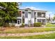 Two-story condominium exterior with screened balconies, neat landscaping and access stairs to units at 2106 Northlake Dr # 2106, Sanford, FL 32773