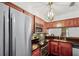 Compact kitchen with stainless steel appliances and modern finishes at 2106 Northlake Dr # 2106, Sanford, FL 32773