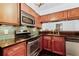 Close-up view of the kitchen features stainless steel oven and matching microwave at 2106 Northlake Dr # 2106, Sanford, FL 32773