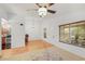 Bright living room featuring a ceiling fan, chandelier, and beautiful hardwood floors at 2106 Northlake Dr # 2106, Sanford, FL 32773