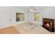 Open living area with a fireplace, carpet, and windows for natural light at 2106 Northlake Dr # 2106, Sanford, FL 32773