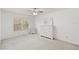 View of the main bedroom, with ceiling fan, dresser, and large sunny window at 2106 Northlake Dr # 2106, Sanford, FL 32773