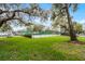 Tennis court surrounded by lush landscaping provides a recreational amenity at 2106 Northlake Dr # 2106, Sanford, FL 32773