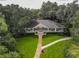 Aerial view of the clubhouse with manicured lawn, beautiful landscaping at 216 Springside Rd, Longwood, FL 32779