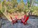 Inviting backyard patio features a brick fire pit, seating, and a charming swing at 216 Springside Rd, Longwood, FL 32779