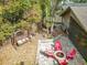 Aerial view of a cozy backyard with a charming swing, firepit, and screened porch at 216 Springside Rd, Longwood, FL 32779