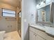 Bathroom featuring gray walls, granite countertop and a glass enclosed shower at 216 Springside Rd, Longwood, FL 32779