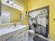 Bright bathroom with a white vanity, modern fixtures, and fun donkey shower curtain at 216 Springside Rd, Longwood, FL 32779